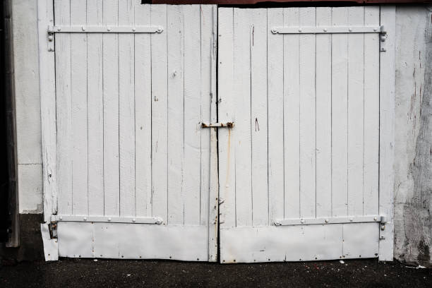 istock Closed white wooden garage port.. 1762116692