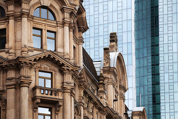 old building in front of a modern skyscraper in Frankfurt am Main, Germany