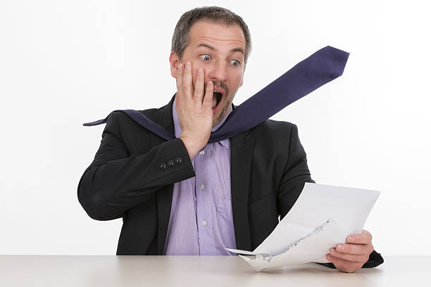 istock Businessman is horrified by a unbelievable bill  II 176216990