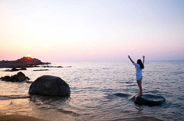 istock Young girl greeting the sunset 176218518