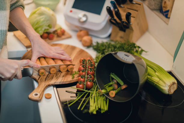 istock Cutting vegetables and separating compost waste in the kitchen 1762216429
