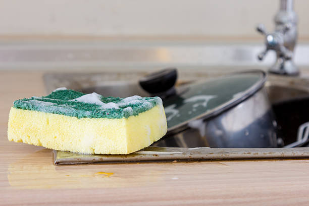 Clean sponge in sink Clean sponge in dirty sink cleaning sponge photos stock pictures, royalty-free photos & images