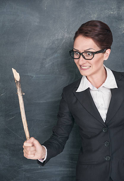 istock Angry teacher with wooden stick 176230978