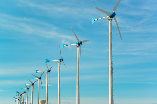 istock white wind turbine generating electricity on blue sky 176231151