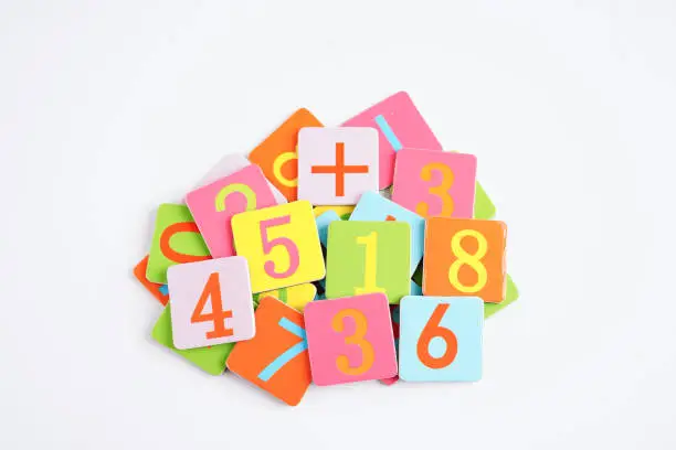 Photo of Number wood block cubes for learning Mathematic, education math concept.