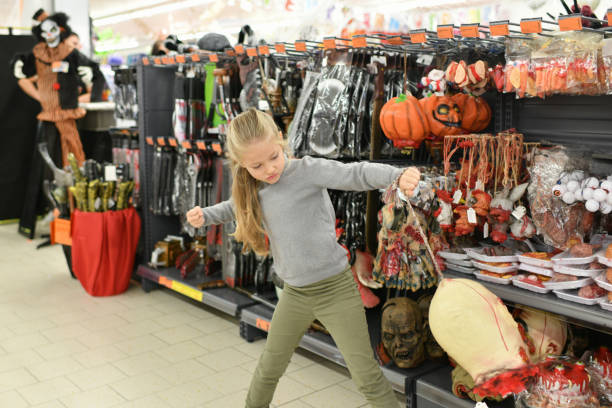 istock A child chooses a costume in a store for Halloween 1762345215