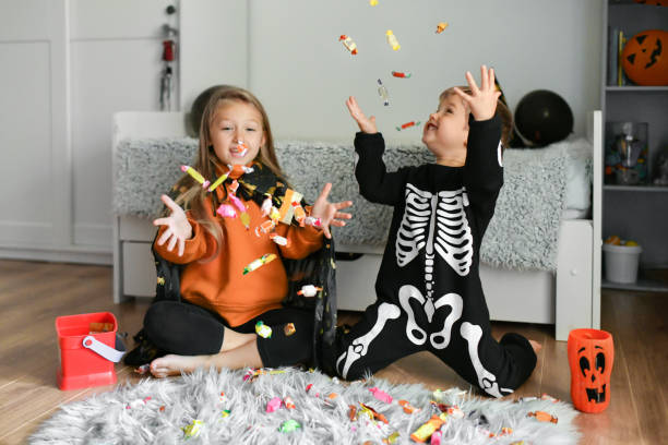 Children enjoy candy collected for Halloween