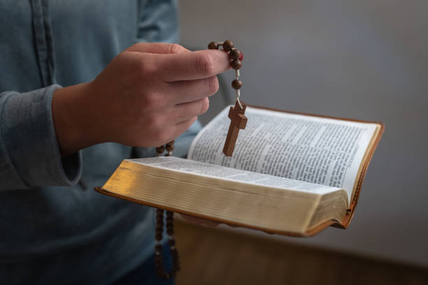 istock A woman prays next to a bible 1762346108