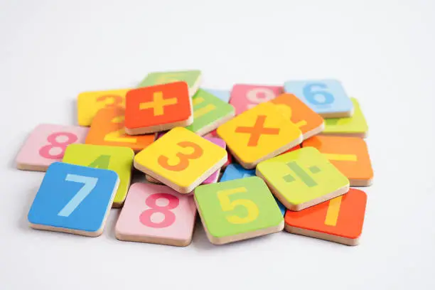 Photo of Number wood block cubes for learning Mathematic, education math concept.