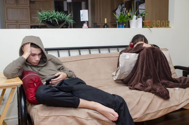 istock Two teenagers with mobile phones 1762355802