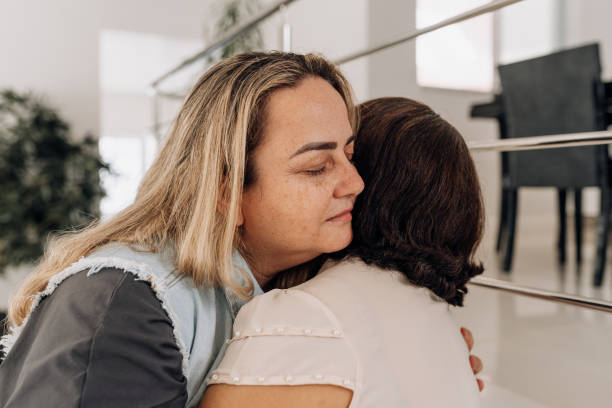 istock Female friends hug each other in support 1762356845