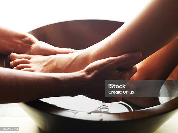 Pedicure Woman Feet Receiving A Foot Massage Stock Photo - Download Image Now - Washing, Pedicure, Spa
