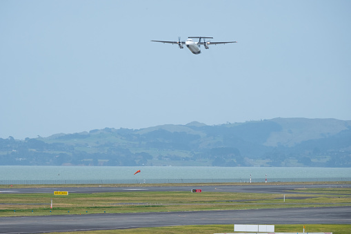 A commercial airplane taking off from runway