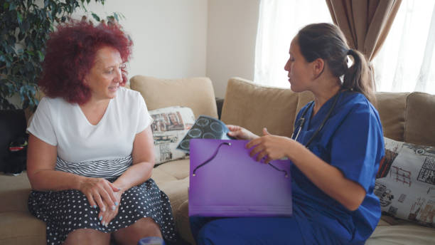 istock Female GP doing home visit. Home caregiver. 1762407769