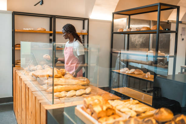 istock Black Female Shop Assistant In An Artisan Bakery 1762410428