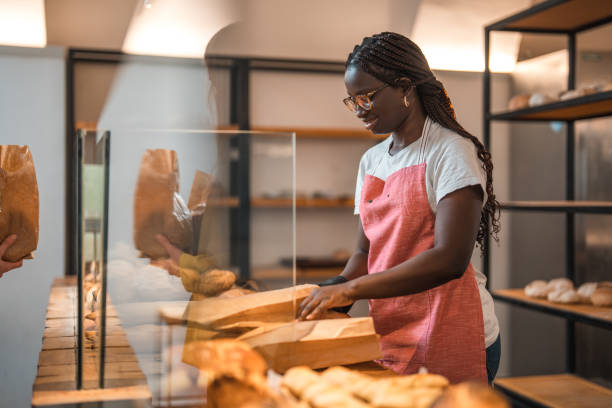 istock Lovely Black Female Preparing Order In An Artisan Bakery 1762410446