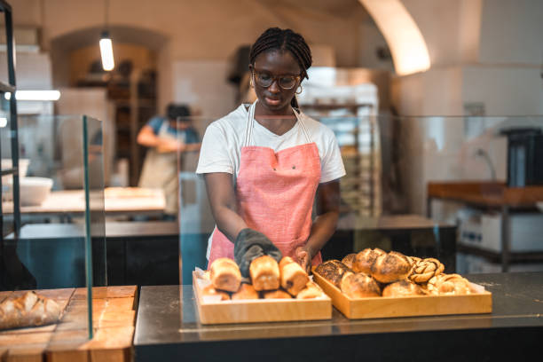 istock Lovely Black Female Preparing Order In An Artisan Bakery 1762410964