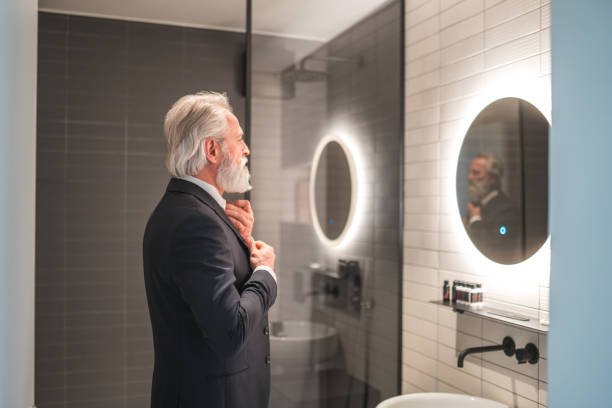 istock Mature Caucasian Businessman Getting Dressed At Home 1762410985