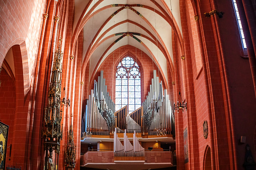 A close-up of a beautiful, classic pipe organ in an Italian church