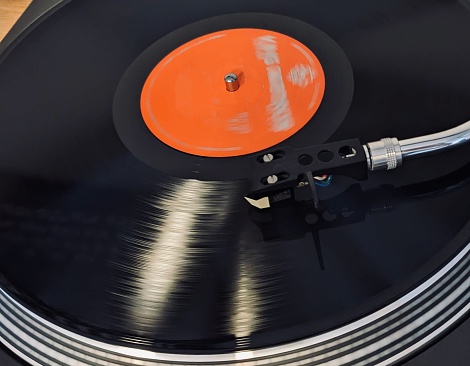 View of playing record on the analog turntable.