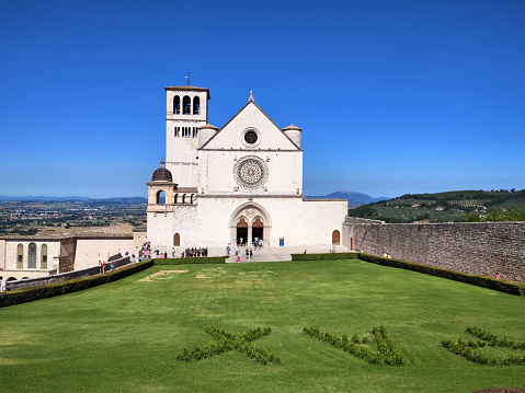 The Basilica di San Francesco d'Assisi, a town in the Umbria region in central Italy, where Saint Francis was born and died. It is one of the most important places of Christian pilgrimage in Italy. The basilica is a distinctive landmark and has been a UNESCO World Heritage Site since 2000.