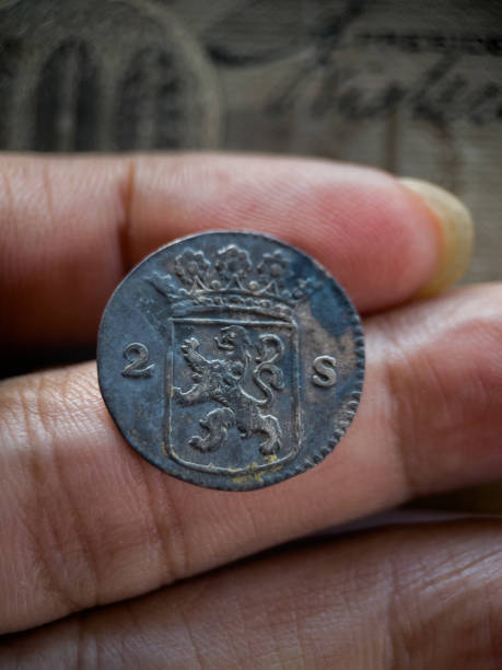 istock Ancient 2 stuiver coin in collector's hands. 1762570539