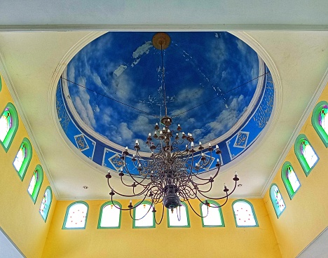 The mosque dome is bright blue