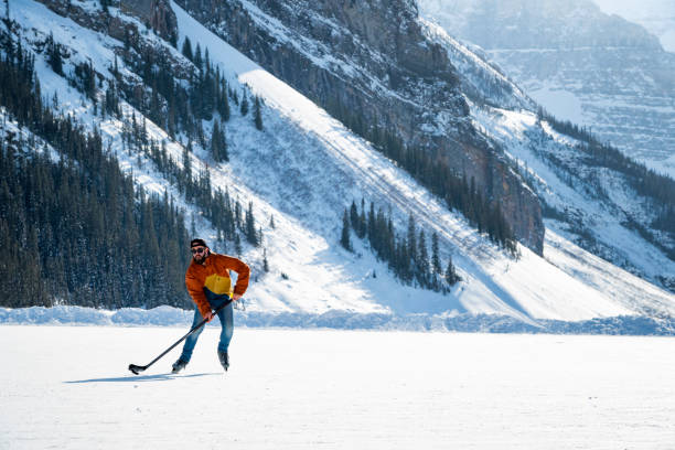 Hockey player on Lake Louise, Canada