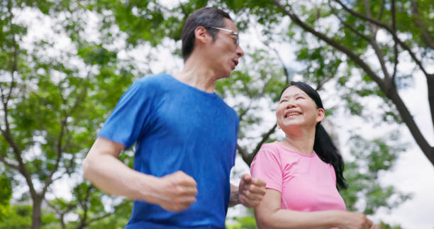 istock elder couple run in park 1762636298