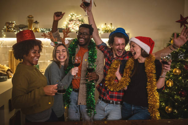istock Cheerful friends having fun while toasting during New year party at home 1762690709