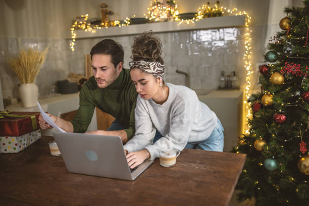 istock Young couple managing finances at home 1762707107