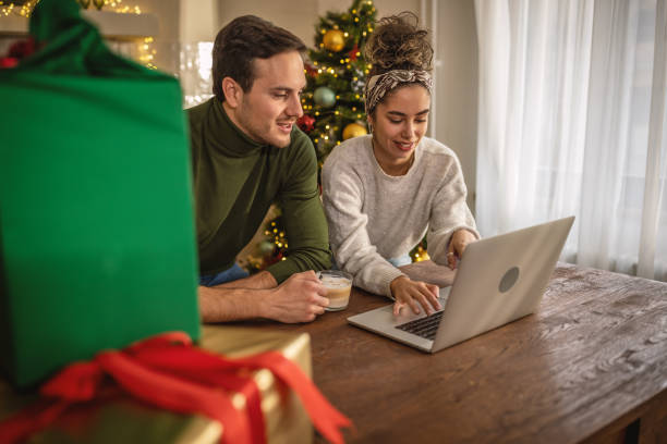 istock Young couple shopping online for Christmas 1762711046