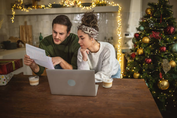 istock Young couple managing finances at home 1762712986
