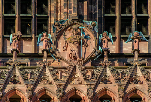 Ornate Gothic facade and intricate decorations of the Notre Dame Cathedral in Strasbourg, France one of the most beautiful Gothic cathedrals at sunset