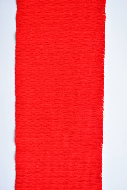 istock red wool knitted yarn texture, woolen fabric on white background 1762788114