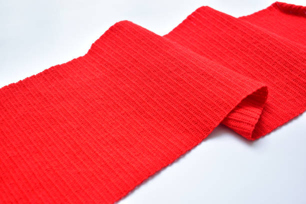 istock wavy of red wool knitted yarn texture, woolen fabric on white background 1762788543