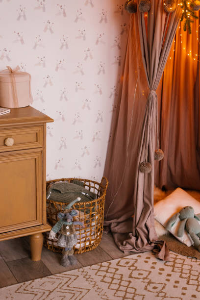 istock Wicker basket with clothes in the children's room 1762812325
