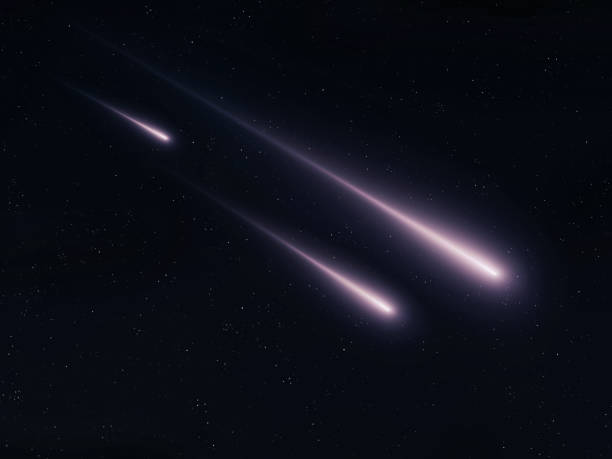 Meteor trails in the sky. Burning meteorites on a black background.