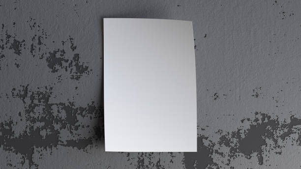 istock Blank sheet of paper vertical mockup on gray wall 1762846998