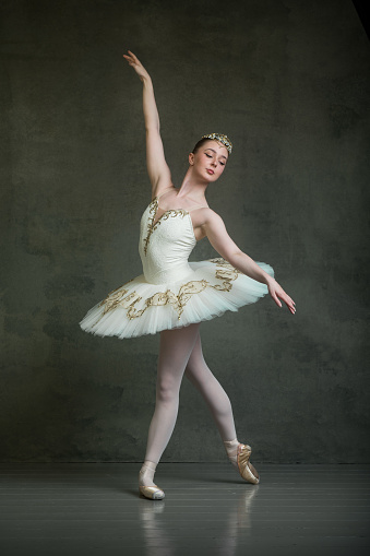 Ballerina in white and gold tutu and tiara