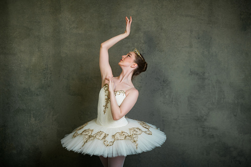 Ballerina in white and gold tutu and tiara