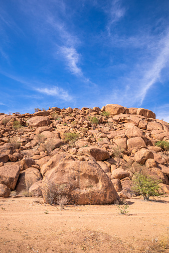 Rock formations near Twijfelfontein, Damaraland, Namibia.  Vertical.