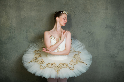 Ballerina in white and gold tutu and tiara