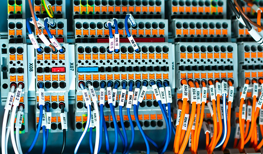 New control panel with circuit-breakers, fuses, rails, low voltage meters, current transformers, relays and other electrical equipment.