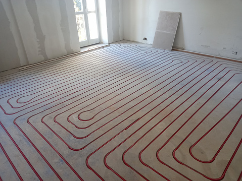 underfloor heating and cooling construction in a building site