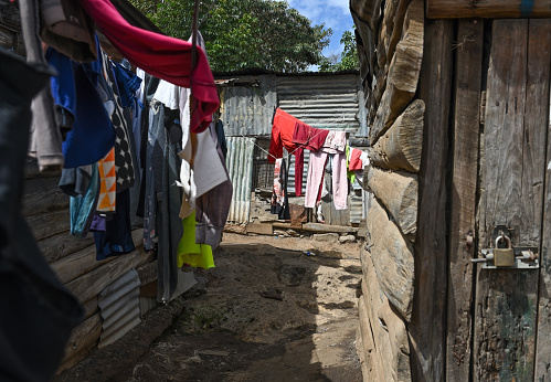 Narrow streets with drying laundry in Kibera slum of Nairobi. The largest urban slums in Africa. Kenya