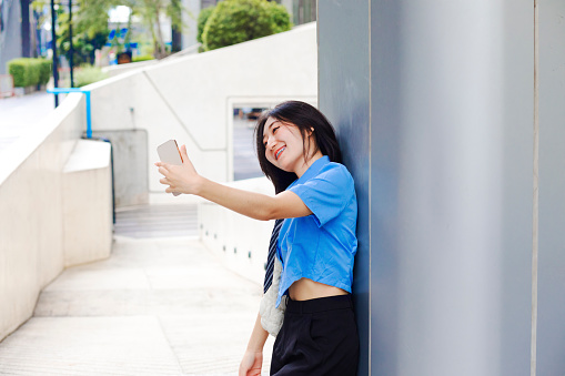 Taking selfie situation with young thai woman