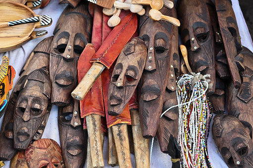 Masks and knives handmade by the Maasai tribes selling on the traditional souvenir market in Nairobi, Kenya