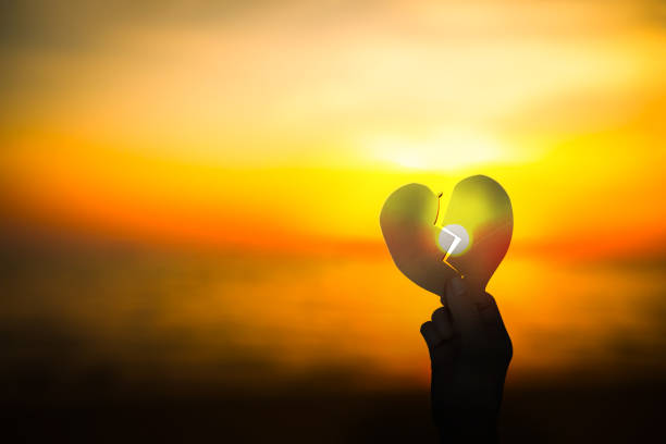 istock Heat Shape on Sunset Orange Black Dark Sunrise Background, Symbole Couple Sad Problem Broken Heart Divorce Valentine Days. Mockup Disappointed Massage Element. 1762928988