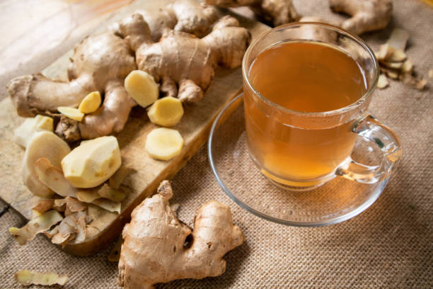 istock Ginger and ginger ale on a wooden table 1762934499